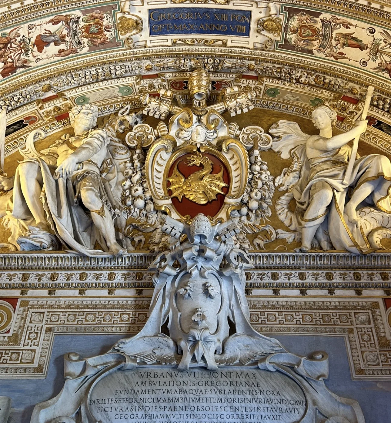Stucco arms of Gregory XIII with the dragon, and the Urban VIII inscription, at the entrance to the Gallery of Maps, Vatican Museums