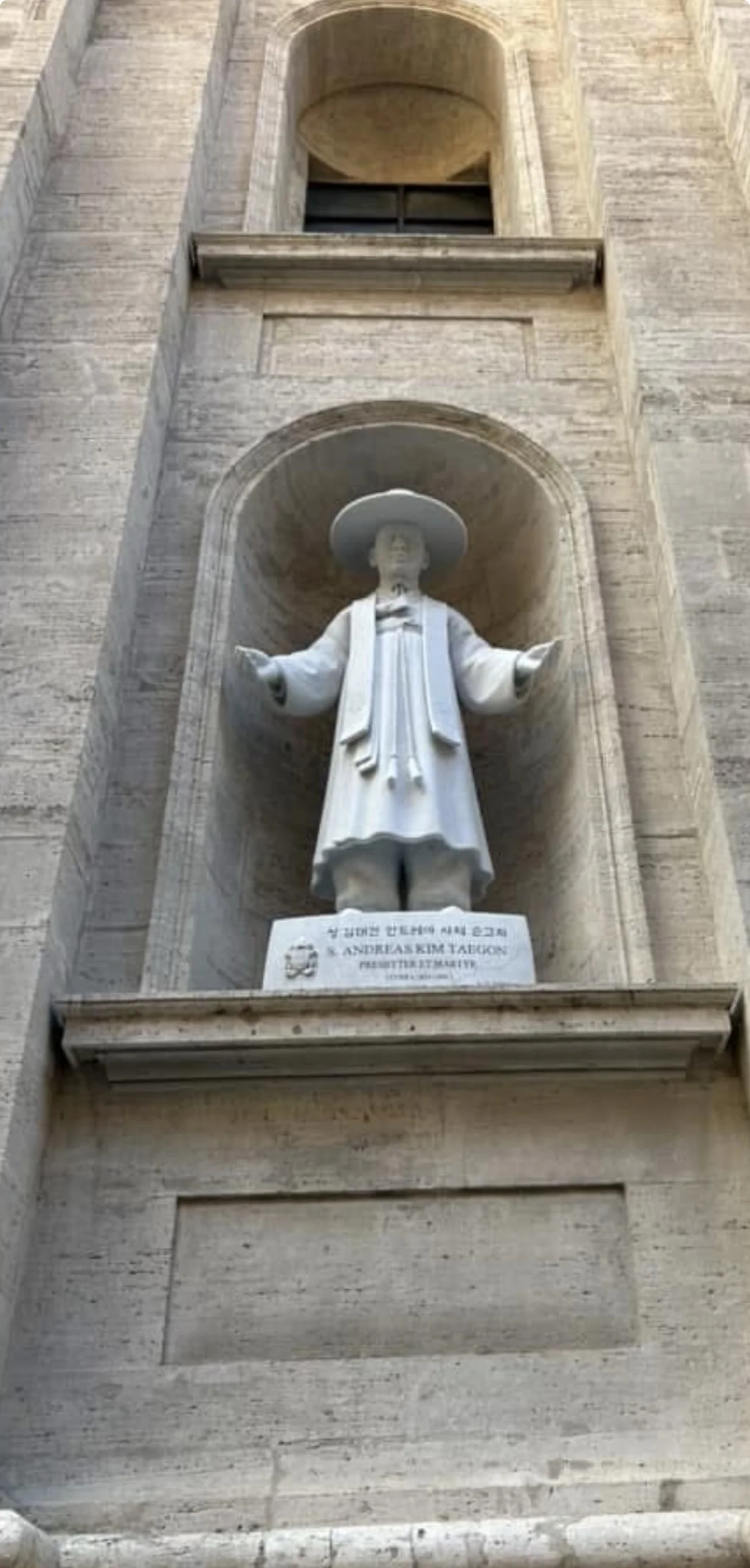 The statue of St. Andrew Kim Taegon, Korean priest and martyr, in a niche on the exterior of St. Peter's Basilica